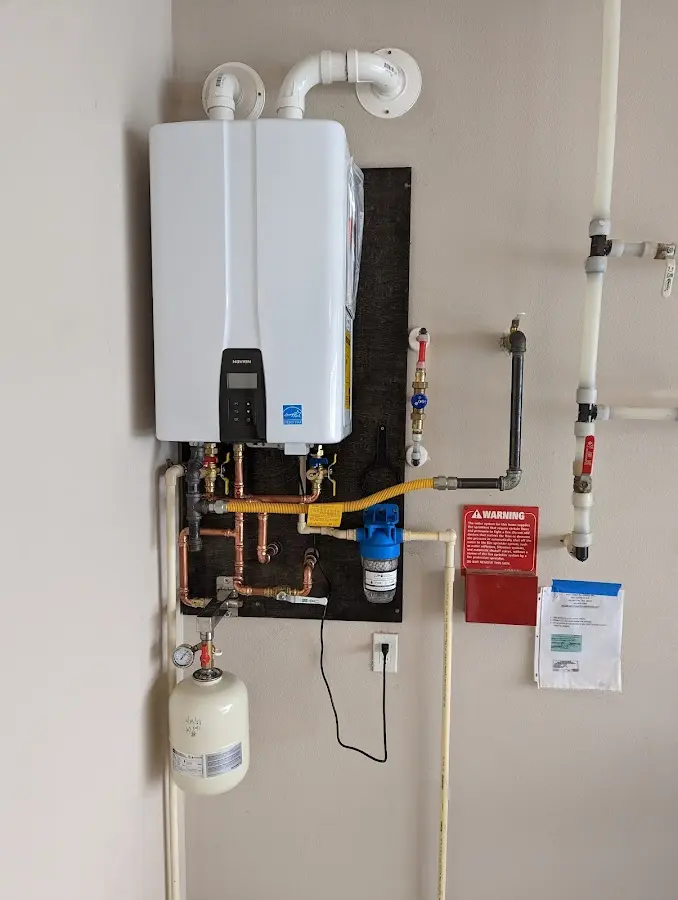 Professional plumber installing copper piping in a Avon Park home